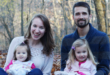 Family Sitting in Leaves